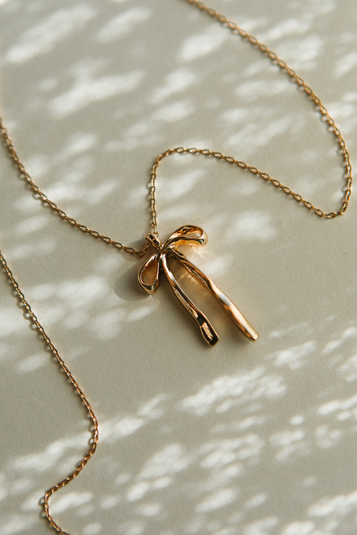 Gold Molten Bow Necklace